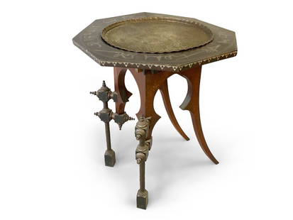 Carlo Bugatti Occasional Table: Carlo Bugatti occasional table, walnut and ebonzied wood with stylized turned legs. The table has a copper tray and metal inlaid characters around the rim. 29in tall x 24.5in wide x 24.5in deep. Prove