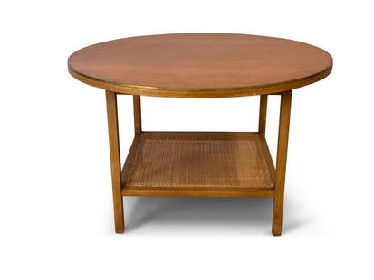 Paul McCobb for Calvin Walnut Coffee Table: A Paul McCobb for Calvin Furniture two-tier walnut and wicker table with brass trim. 20in tall x 32in diameter. | Philadelphia Metro area delivery, NYC curbside delivery, and international third-party