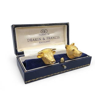 Pair of 18K Deakin & Francis Cufflinks: A pair of 18k yellow gold bull and bear cufflinks by Deakin and Francis, England. Each with ruby eyes. 21.1 total dwt. | Philadelphia Metro area delivery, NYC curbside delivery, and international