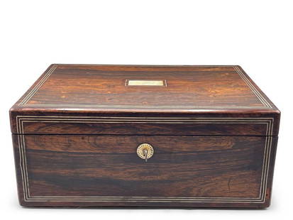 19th C. Rosewood and Brass Writing Desk: A 19th C. rosewood writing box with black embossed leather writing surface, small wooden compartments, and mother of pearl inlay. Key is present. 6in tall x 14in wide. | Philadelphia Metro area delive