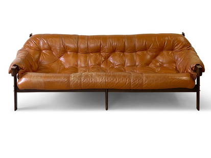 Percival Lafer MP-41 Rosewood and Leather Sofa: A Percival Lafer MP-41 sofa with a Brazilian rosewood frame and tufted cognac leather upholstery. One leather strap with impressed mark. 27in tall x 79in wide x 34in deep. Seat height: 17in. | Philade