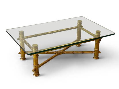 Hollywood Regency-style Cocktail Table: A Hollywood Regency-style glass top coffee table with a giltwood faux bamboo frame. 16-1/2in tall x 48in wide x 30-1/4in deep. | Philadelphia Metro area delivery, NYC curbside delivery, and internatio