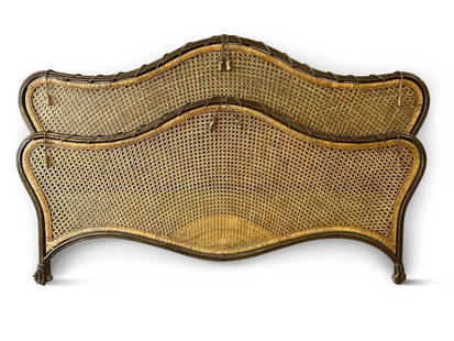 Decorator French-style Caned Bed: A king-size decorator French-style metal and cane bed frame with tassel decoration. Lacking metal frame. 84in wide x 53in tall. | Philadelphia Metro area delivery, NYC curbside delivery, and internati