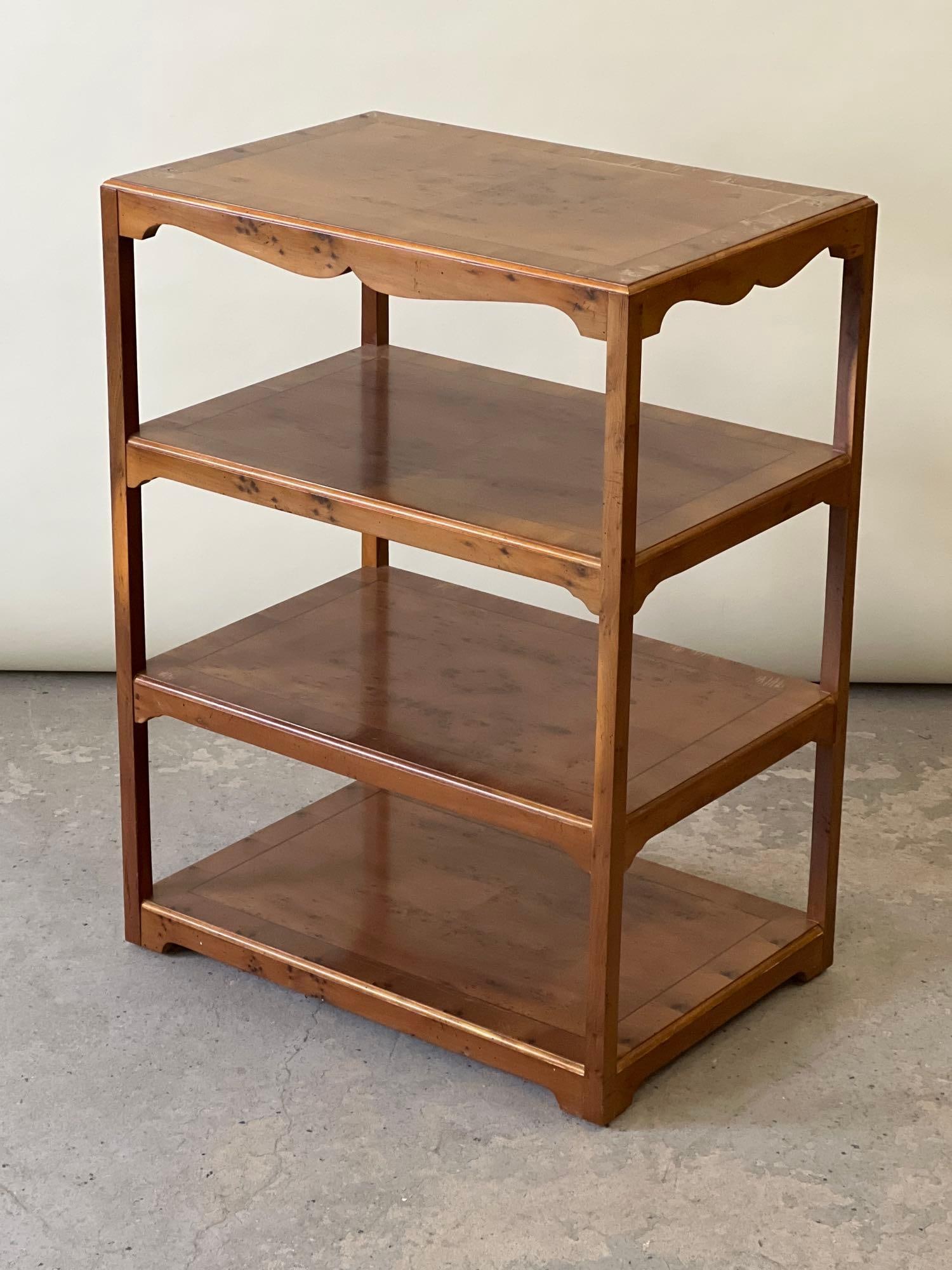 Baker Burlwood Four-Tiered Stand: A Baker Furniture burlwood four-tiered stand. 27in tall x 20-1/2in wide x 14in deep. | Philadelphia Metro area delivery, NYC curbside delivery, and international third-party shipper information are al