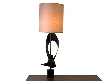 Harry Balmer for Laurel Ribbon Table Lamp: A Harry Balmer for Laurel brutalist metal table lamp of large size with a sculpted metal ribbon form on an ebonized wood base and with original drum shade. Top of shade marked "Laurel". 55-1/4in tall