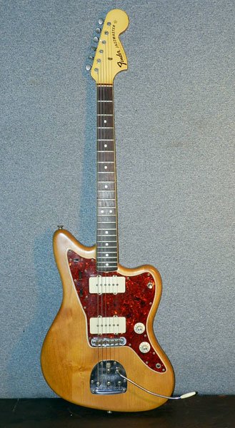 Fender Jazzmaster Guitar: Fender Jazzmaster electric guitar with solid wood body, and with case. Serial# 126550. 41" long; 14" wide.