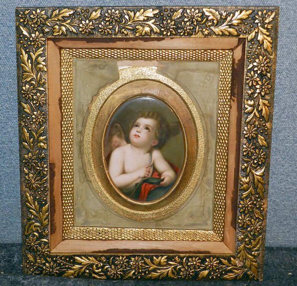 Painting on Porcelain: Unsigned, painting on porcelain. Gilt-framed, portrait of Cupid. Oval image: 7-1/2" x 5-1/2".