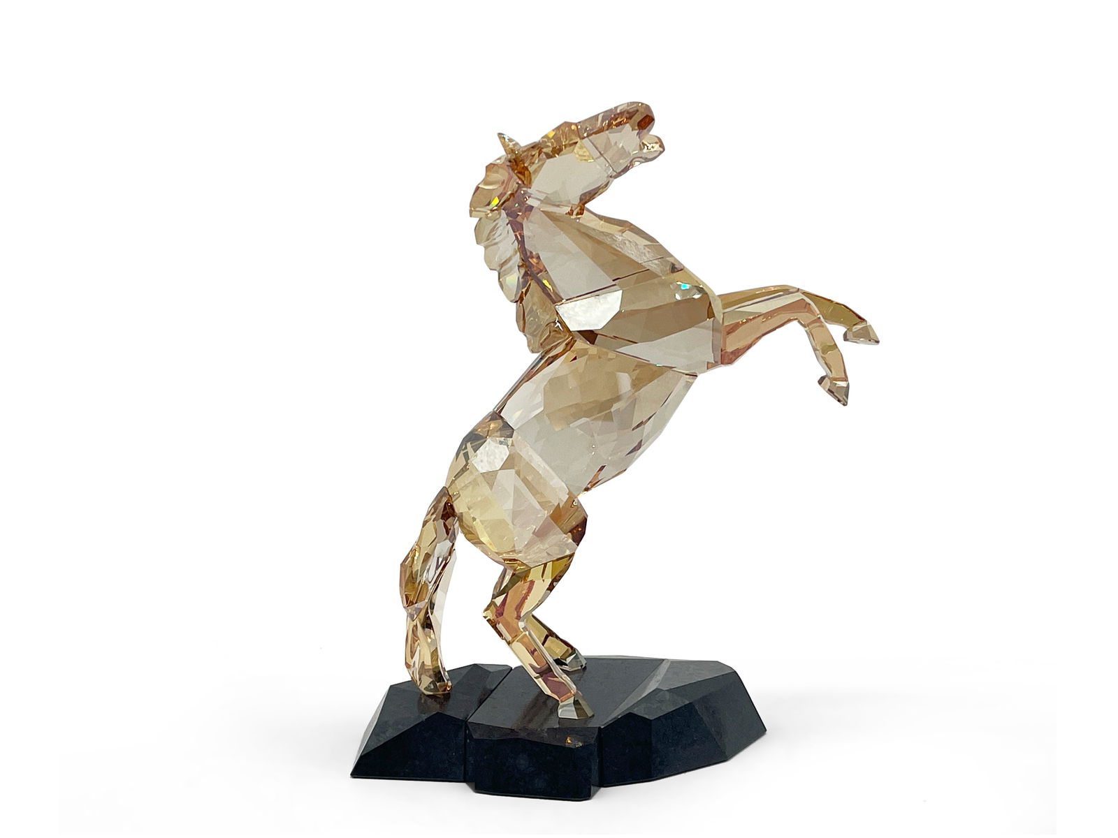 Swarovski Crystal Stallion: A Swarovski crystal gold-tone stallion figure resting on granite base. Swarovski logo on tail. 8-1/2in tall x 5-1/2in wide. | Philadelphia Metro area delivery, NYC curbside delivery, and international