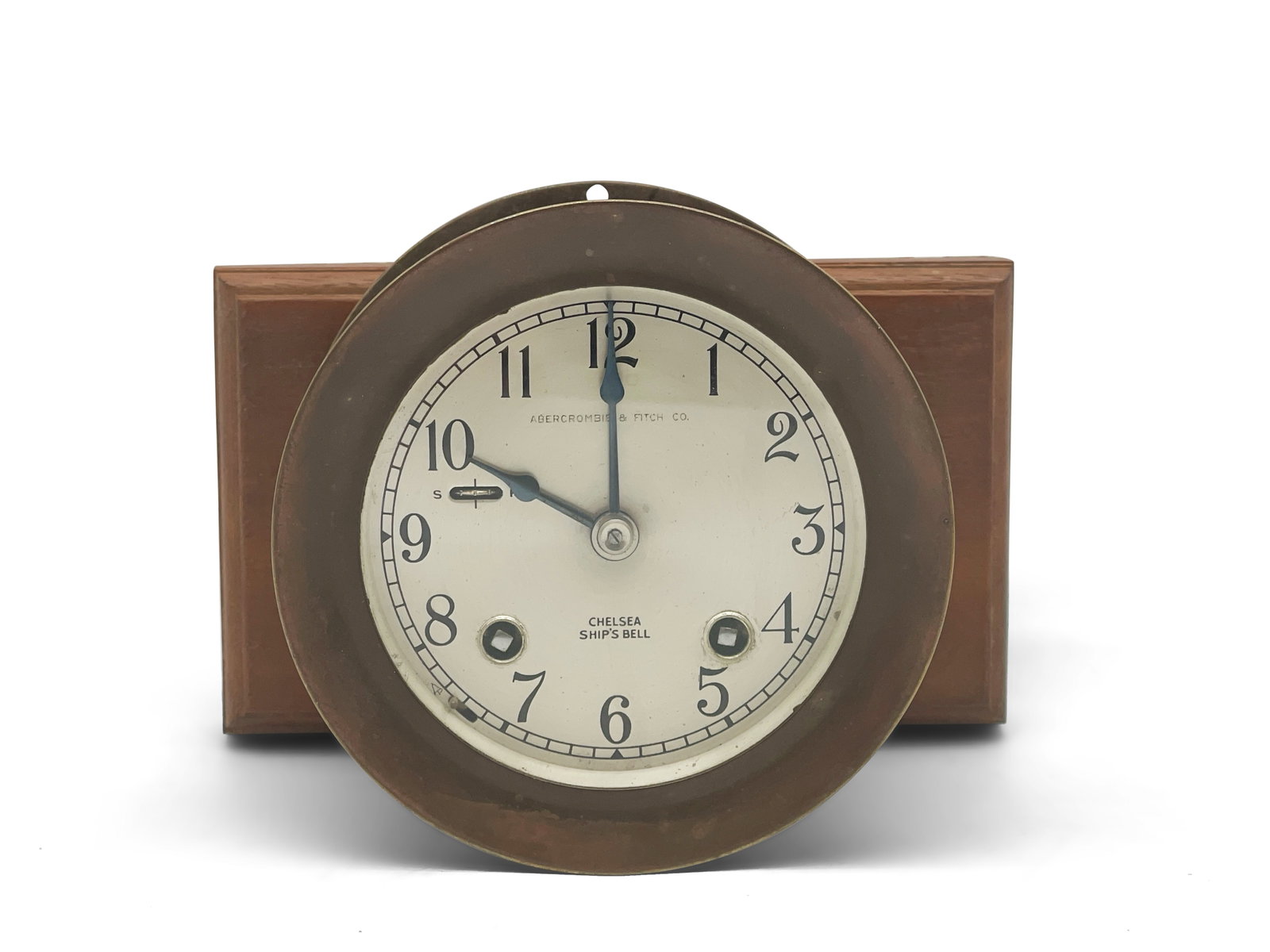 Abercrombie & Fitch Chelsea Ship's Clock: An Abercrombie & Fitch Co. brass Chelsea Ship's Clock, with a wooden mount. 5in tall x 5in wide. | Philadelphia Metro area delivery, NYC curbside delivery, and international third-party shipper inform