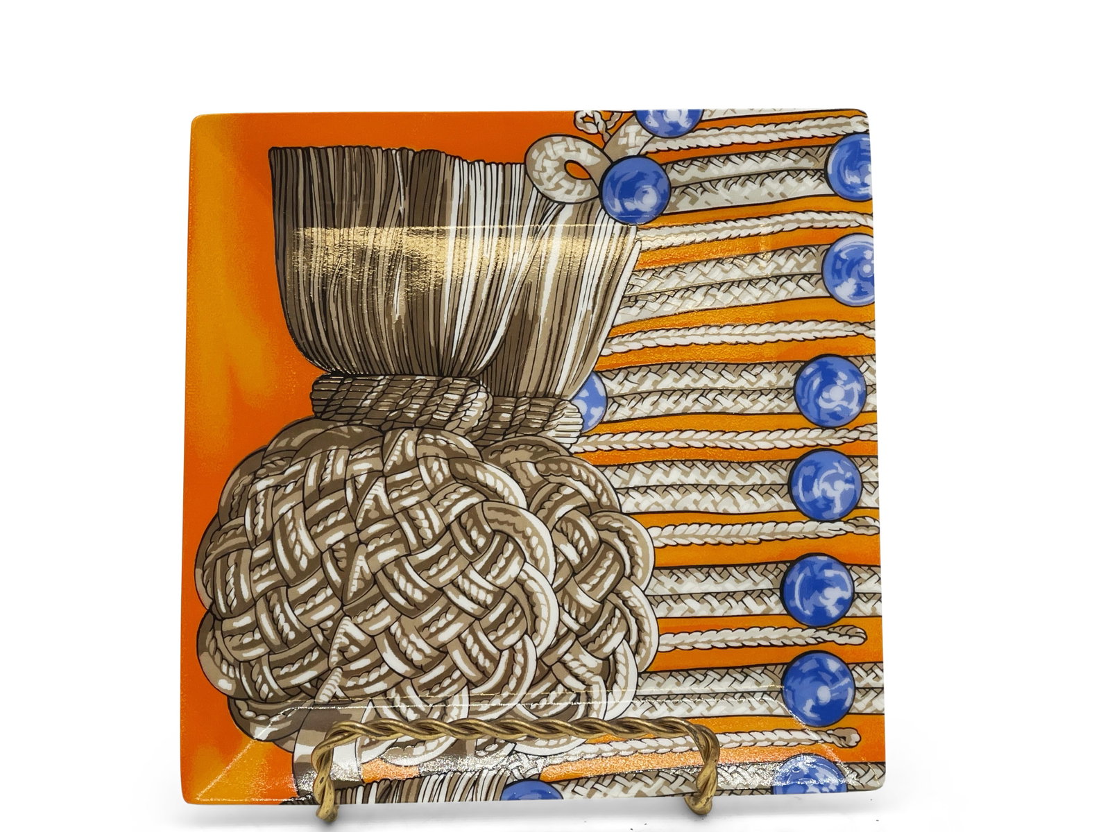 Hermès Brandebourgs Porcelain Plate: An Hermès Brandebourgs porcelain square plate with vibrant braided rope motif. Marked on back. 6-1/2in tall x 6in wide. | Philadelphia Metro area delivery, NYC curbside delivery, and internatio