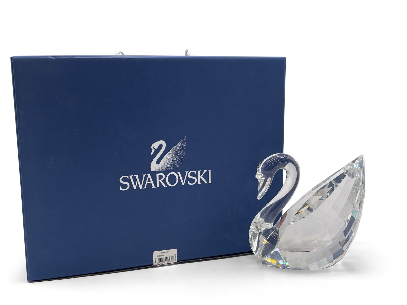 Swarovski Crystal Maxi Swan with Box: A Swarovski crystal maxi swan with original box. Signed and branded with Swarovski logo. 7in tall x 6-1/2in wide. | Philadelphia Metro area delivery, NYC curbside delivery, and international third-par
