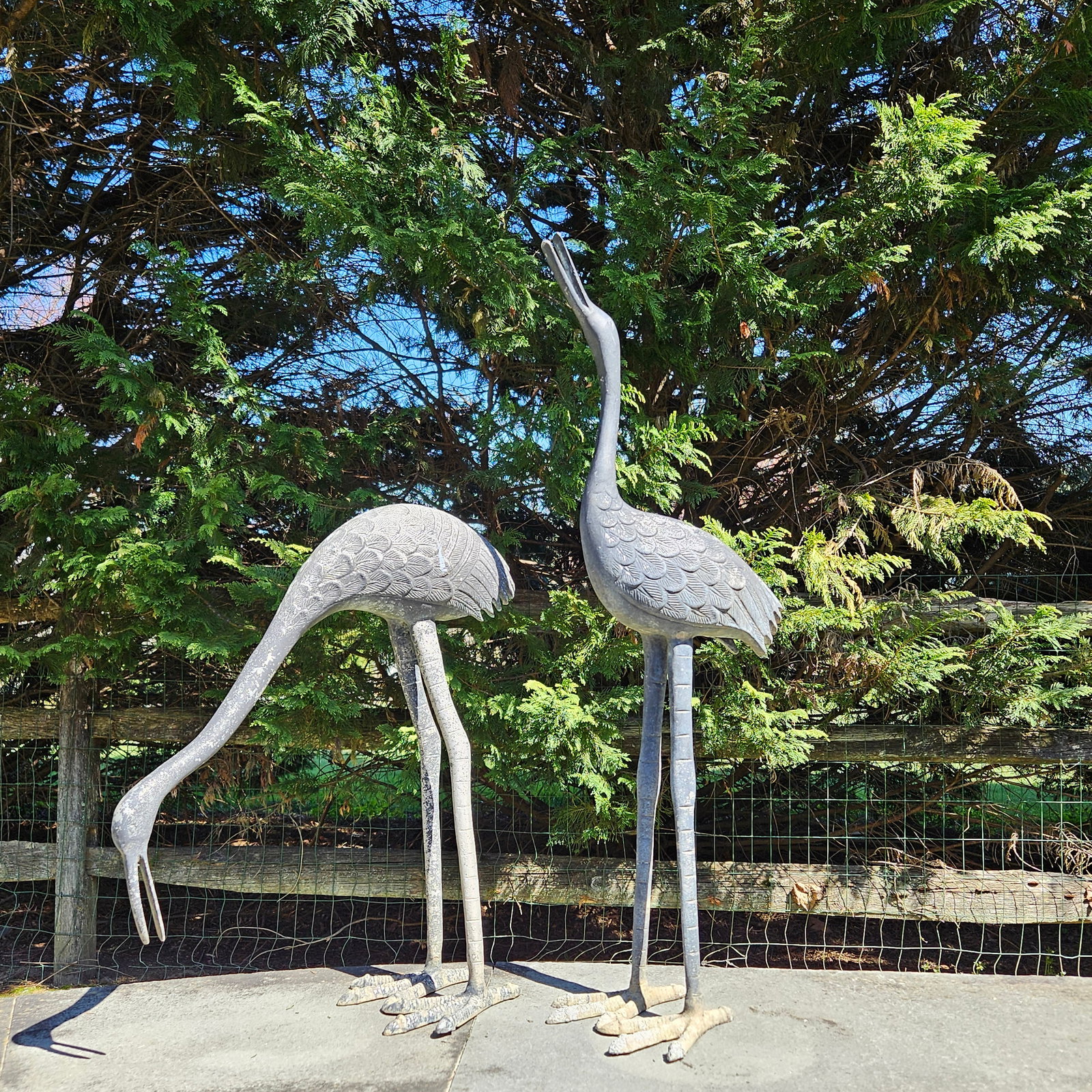 Pair of Cast Aluminum Garden Cranes: A pair of cast aluminum garden crane sculptures. Taller: 34in. | Philadelphia Metro area delivery, NYC curbside delivery, and international third-party shipper information are all available on our web