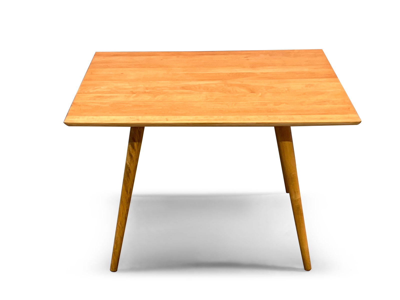 Paul McCobb Planner Group Cocktail Table: A Paul McCobb Planner Group cocktail coffee table on splayed, tapering legs. Unmarked. 20-1/2in tall x 32in wide x 32in deep. | Philadelphia Metro area delivery, NYC curbside delivery, and internation