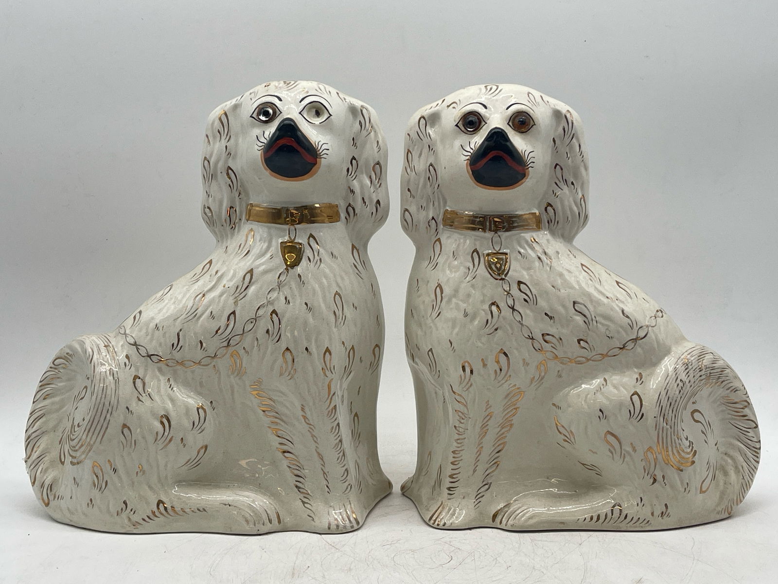 Pair English Staffordshire Dog Figures: A pair of English Staffordshire dog figures. 12-1/2in tall x 9-1/2in wide. | Philadelphia Metro area delivery, NYC curbside delivery, and international third-party shipper information are all availabl