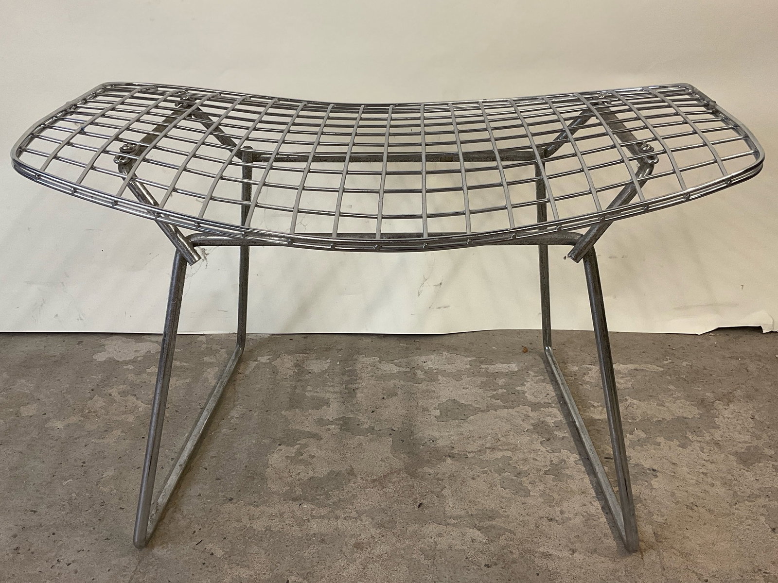 Bertoia-style Chrome-Plated Ottoman: A Bertoia-style chrome-plated wire ottoman. 14-1/2in tall x 23in wide x 14-1/2in deep. | Philadelphia Metro area delivery, NYC curbside delivery, and international third-party shipper information are 