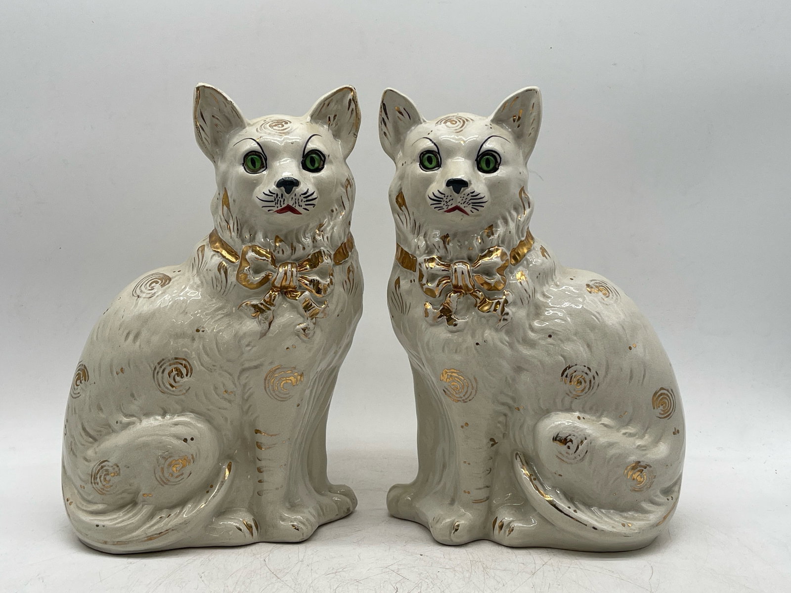 Pair of Staffordshire Creamware Cats: A pair of Staffordshire creamware cats with gilt decoration and glass eyes. 12-1/2in tall x 7in wide. | Philadelphia Metro area delivery, NYC curbside delivery, and international third-party shipper i