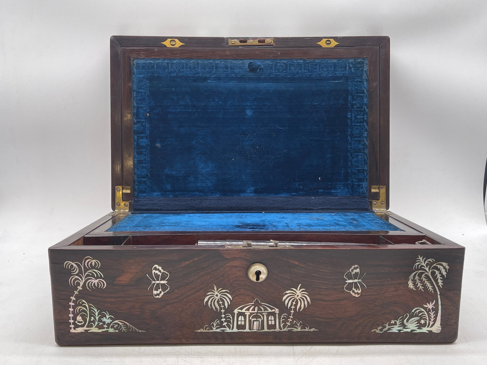 Mahogany Inlaid Travel Writing Desk: A mahogany travel writing desk with mother of pearl inlay, inkwell, and blue velvet-lined interior. 6in tall x 16in wide x 10in deep. | Philadelphia Metro area delivery, NYC curbside delivery, and int