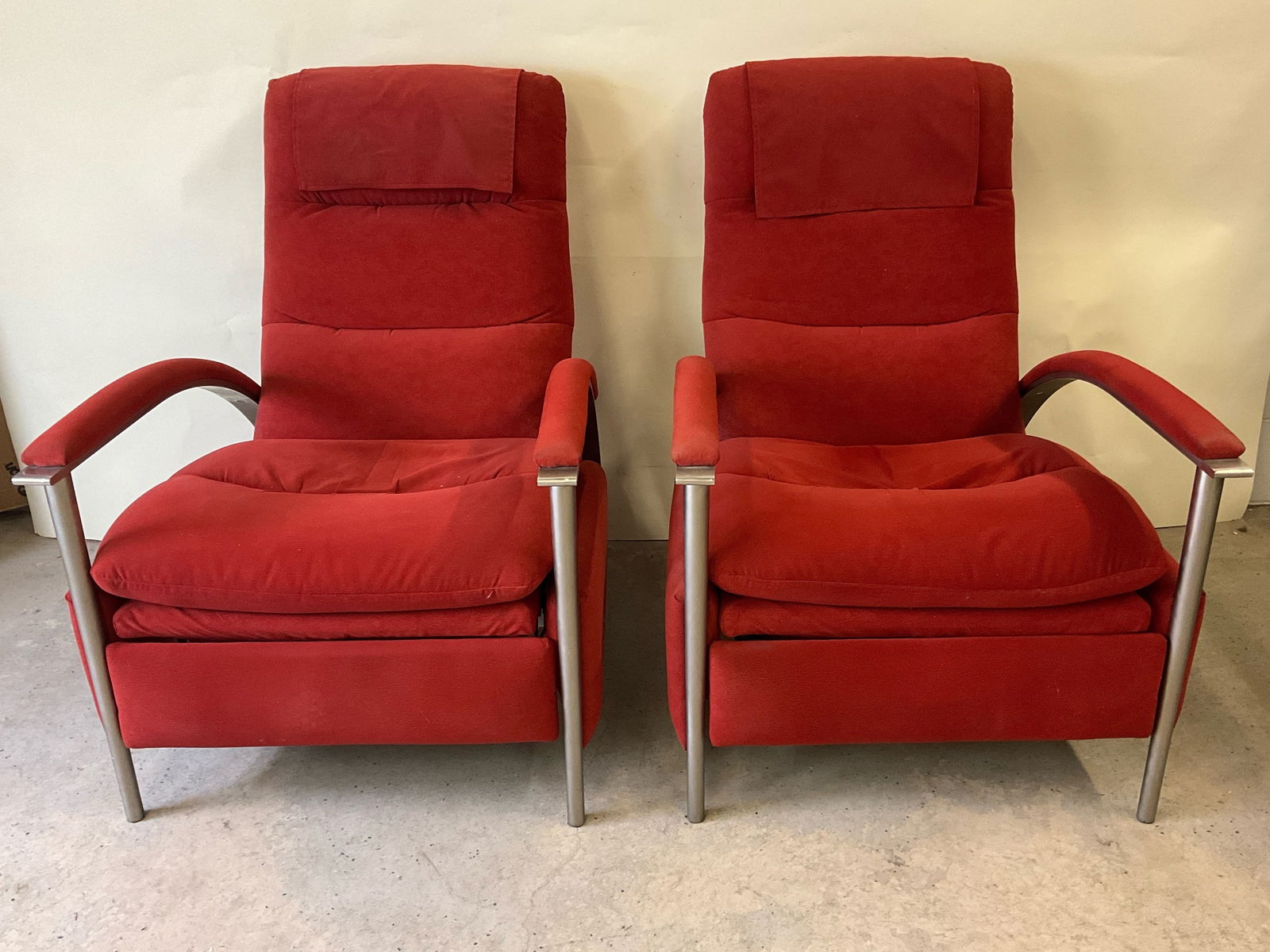 Pair of Ethan Allen Radius Recliners: A pair of Ethan Allen Radius recliners with steel frames and red upholstery. 39in tall x 28in wide x 34-1/2in deep. | Philadelphia Metro area delivery, NYC curbside delivery, and international third-p