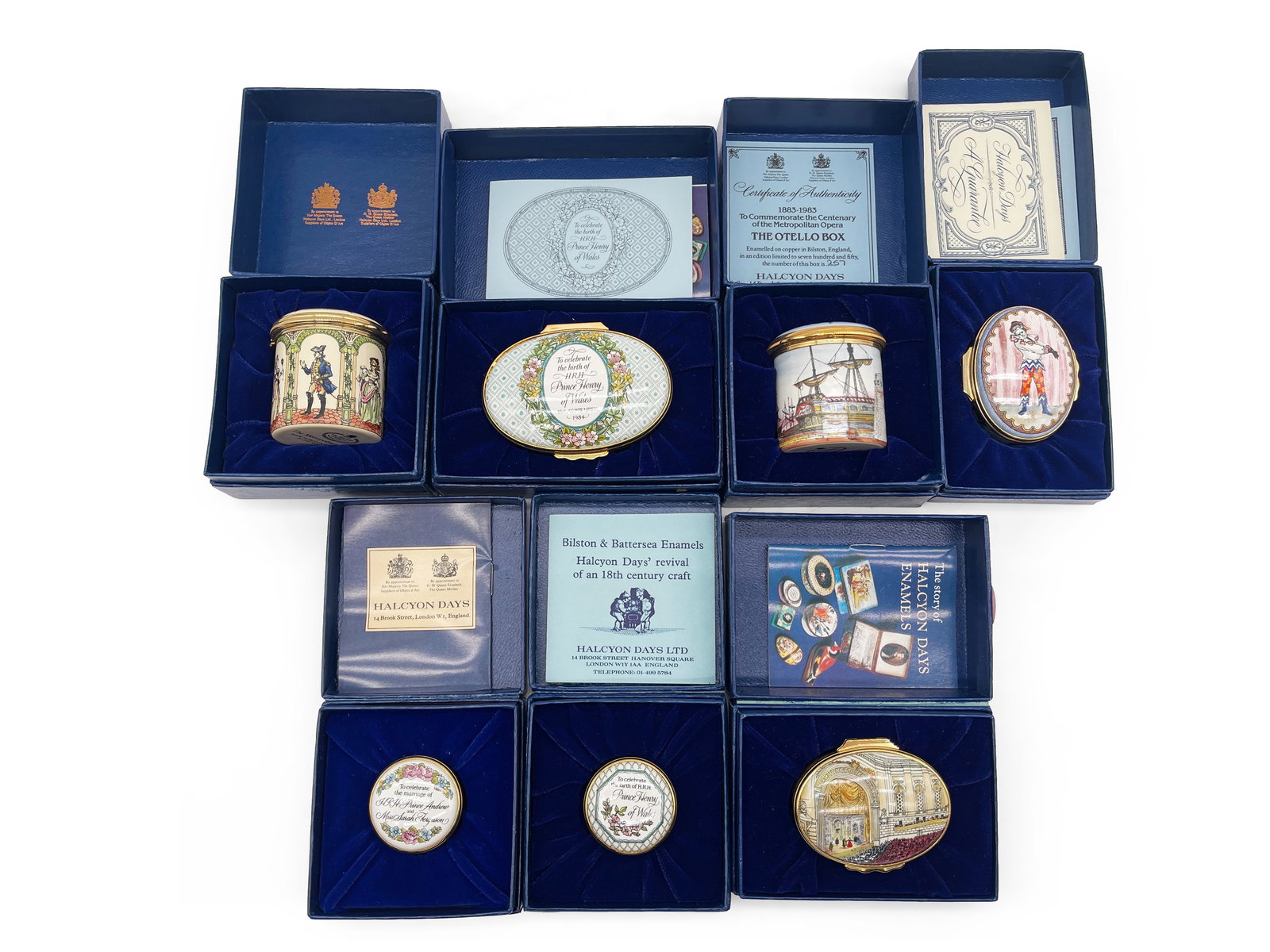 Seven Halcyon Day Enamel Trinket and Music Boxes: Six Halcyon Day enamel trinket boxes and one music box. Largest: 2in tall x 1-1/2in wide. | Philadelphia Metro area delivery, NYC curbside delivery, and international third-party shipper information a