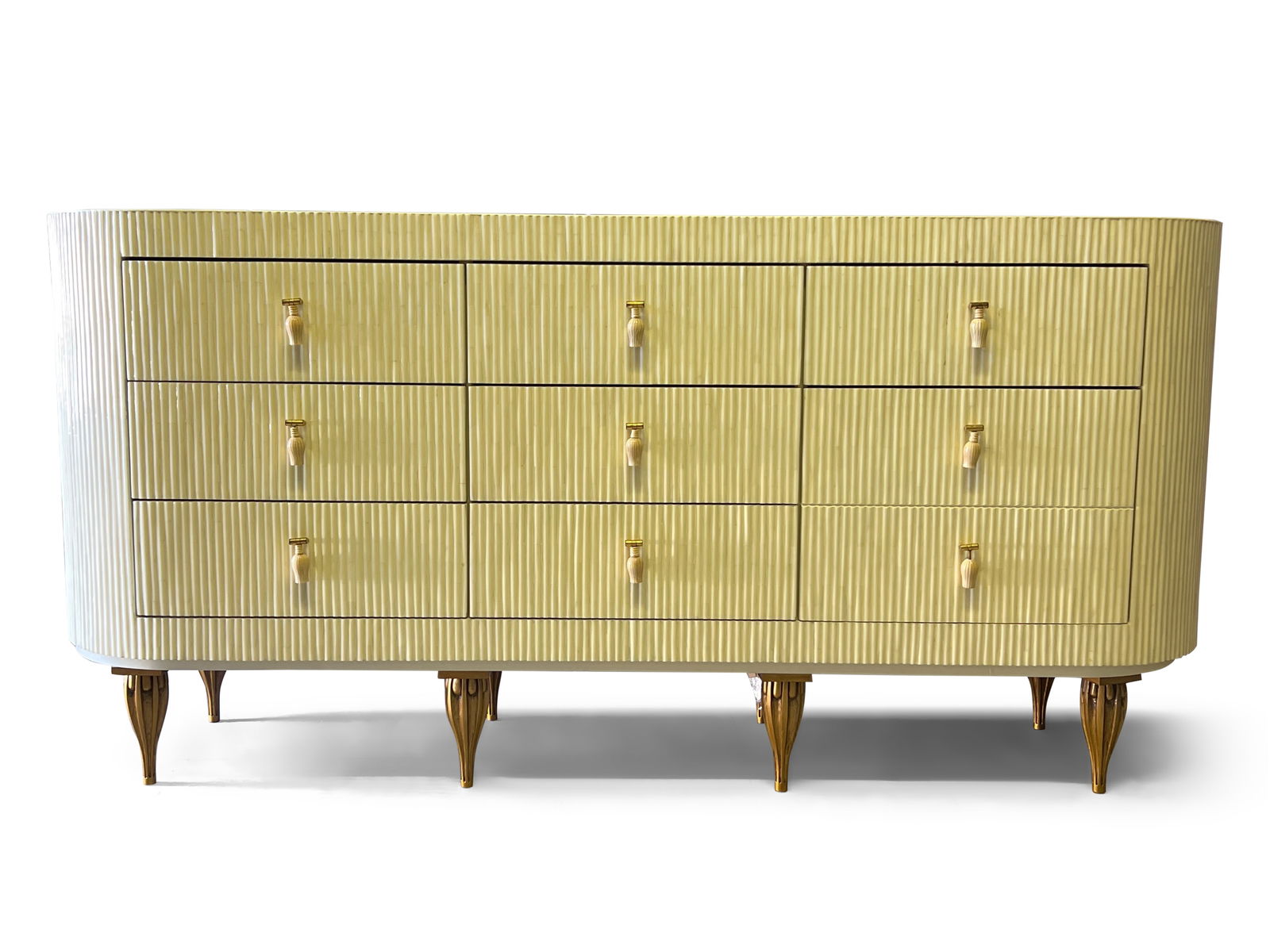 Enrique Garcel Tessellated Bone Dresser: An Enrique Garcel tessellated bone chest of drawers with drop pulls and gilt reeded and tapering legs. Labeled. 34-1/2in tall x 72in wide x 18in deep. | Philadelphia Metro area delivery, NYC curbside