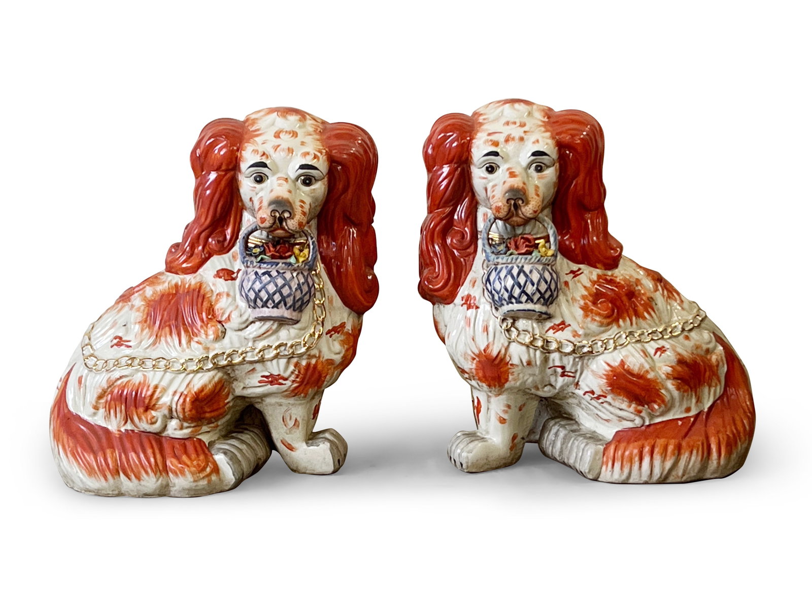 Pair of Monumental Staffordshire-Style Dogs: A pair of monumental Staffordshire-style porcelain spaniels holding baskets. 20in tall x 18in wide. | Philadelphia Metro area delivery, NYC curbside delivery, and international third-party shipper inf
