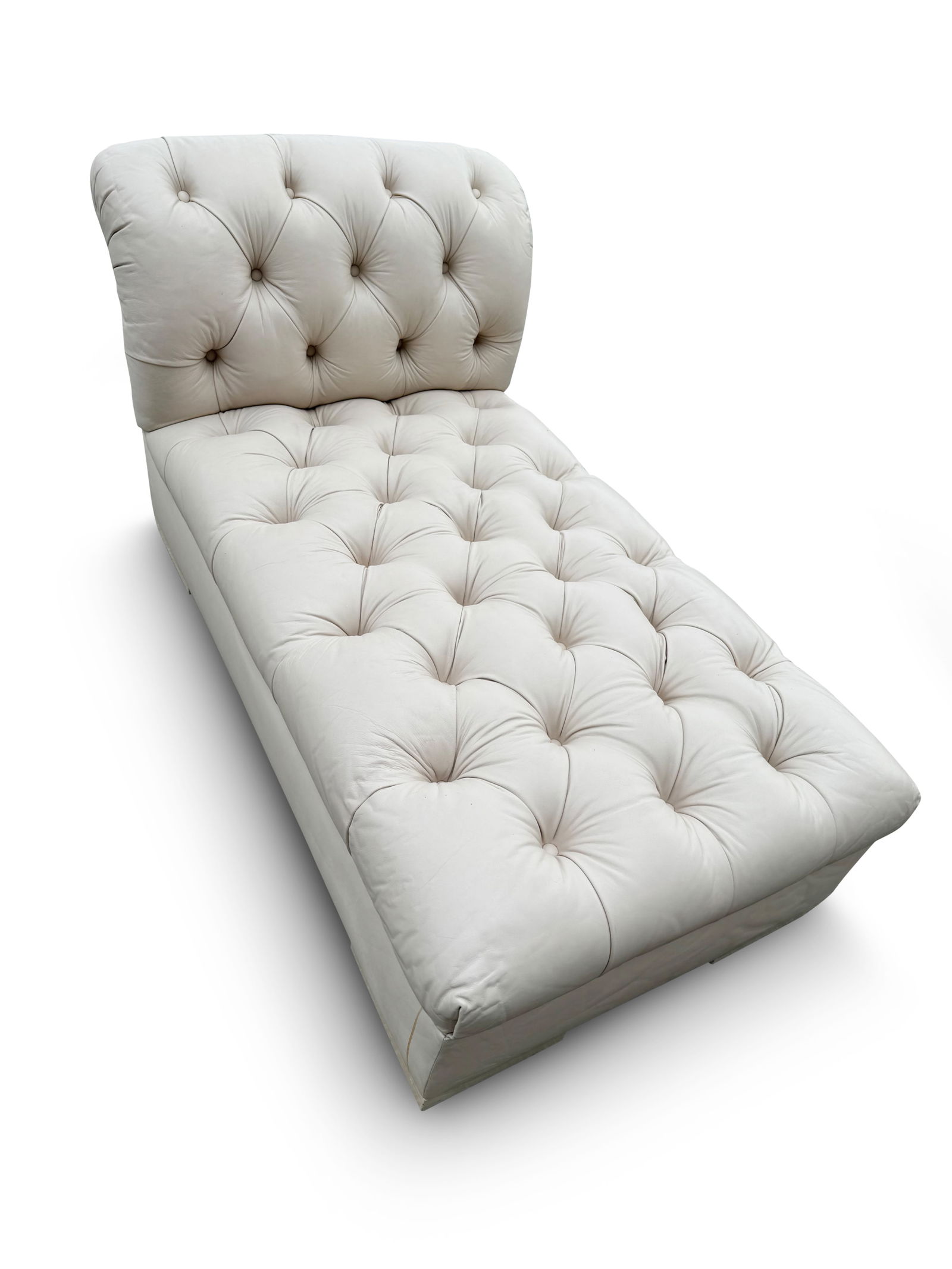 Beige Leather Tufted Chaise Lounge: A beige leather tufted chaise lounge. 29-1/2in tall x 48in wide x 24in deep. | Philadelphia Metro area delivery, NYC curbside delivery, and international third-party shipper information are all availa