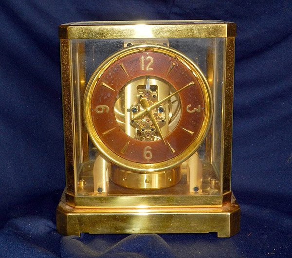 LeCoultre Atmos Shelf Clock: LeCoultre Atmos shelf clock in brass and glass case. 9-1/2" high x 8" wide x 6-1/2" deep.