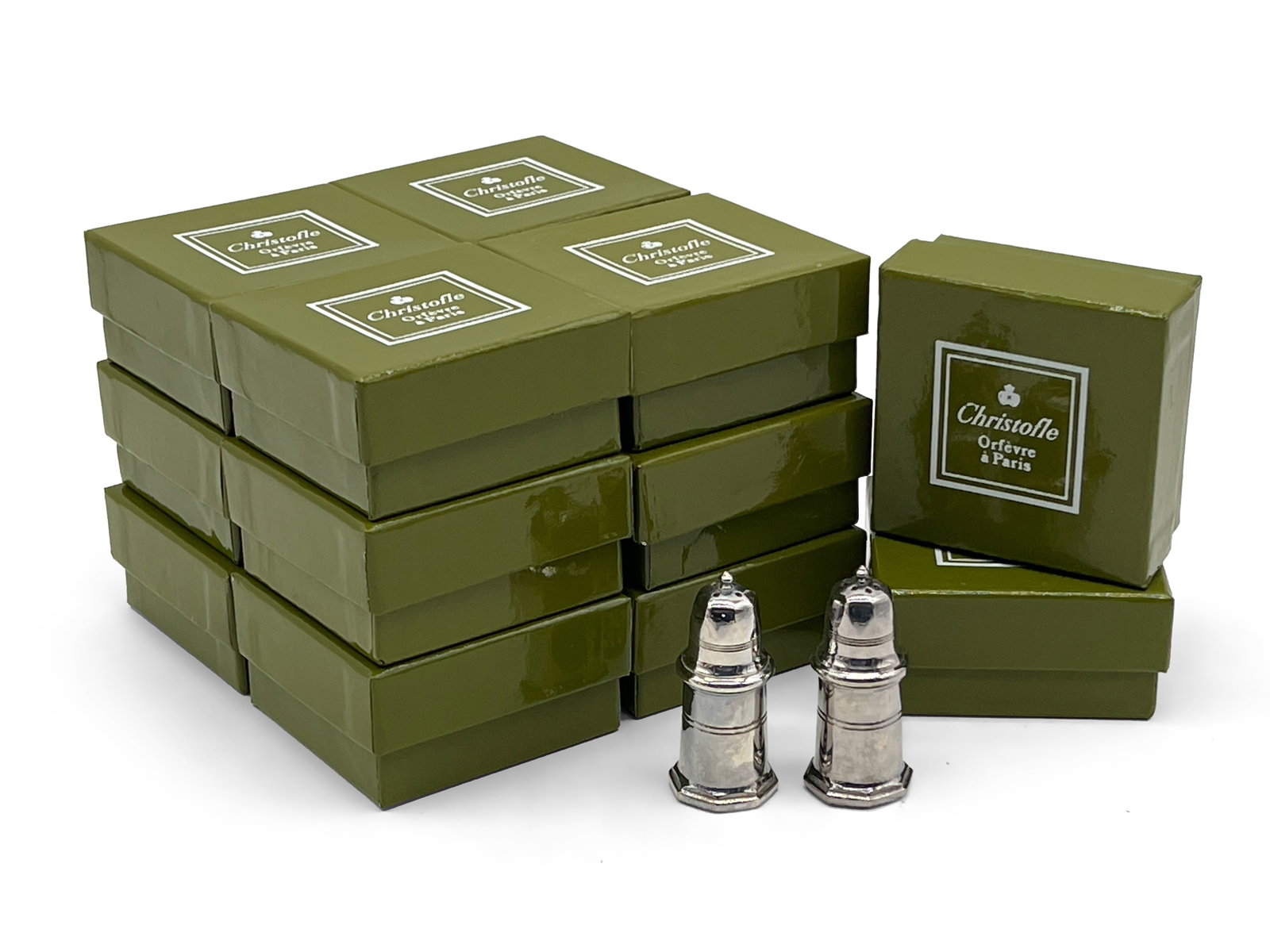 Fourteen Cristofle Salt and Pepper Shakers: A grouping of fourteen Cristofle, France, silver plate salt and pepper shakers in their original boxes. 2in tall. | Philadelphia Metro area delivery, NYC curbside delivery, and international third-par