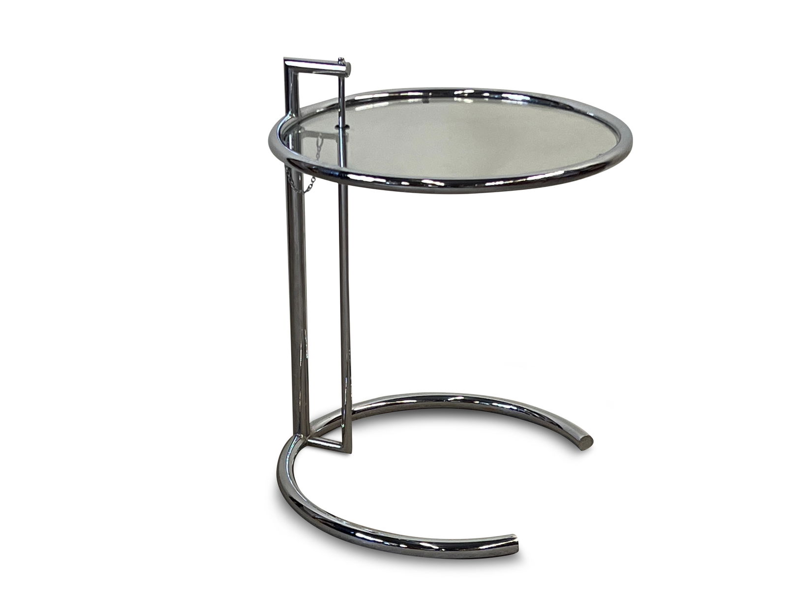 Eileen Gray Side Table: An Eileen Gray adjustable-height side table with glass top and chromed steel frame. Unmarked. As photographed: 24-1/2in tall x 20in wide. | Philadelphia Metro area delivery, NYC curbside delivery, and