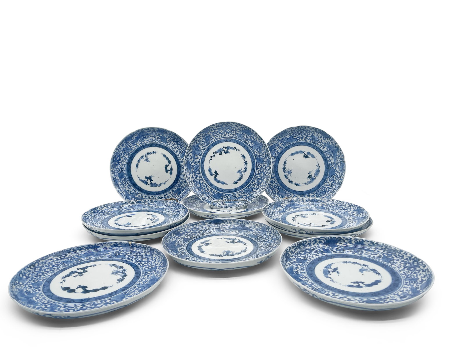11 Chinese Blue & White Crane Plates: A set of 11 Chinese blue and white plates with crane decoration and six-character mark on backs. 8in diameter. Provenance: From the home of the late Helen E. Scott on the Ardrossan estate in Villanova