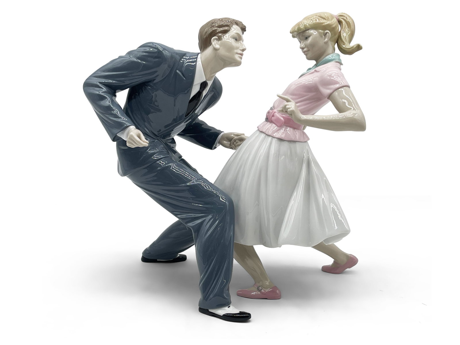 Lladro Sock Hop Figurine: A Lladro porcelain figurine with sock hop dancers. Marked on underside. 13in tall x 12in wide. | Philadelphia Metro area delivery, NYC curbside delivery, and international third-party shipper informat