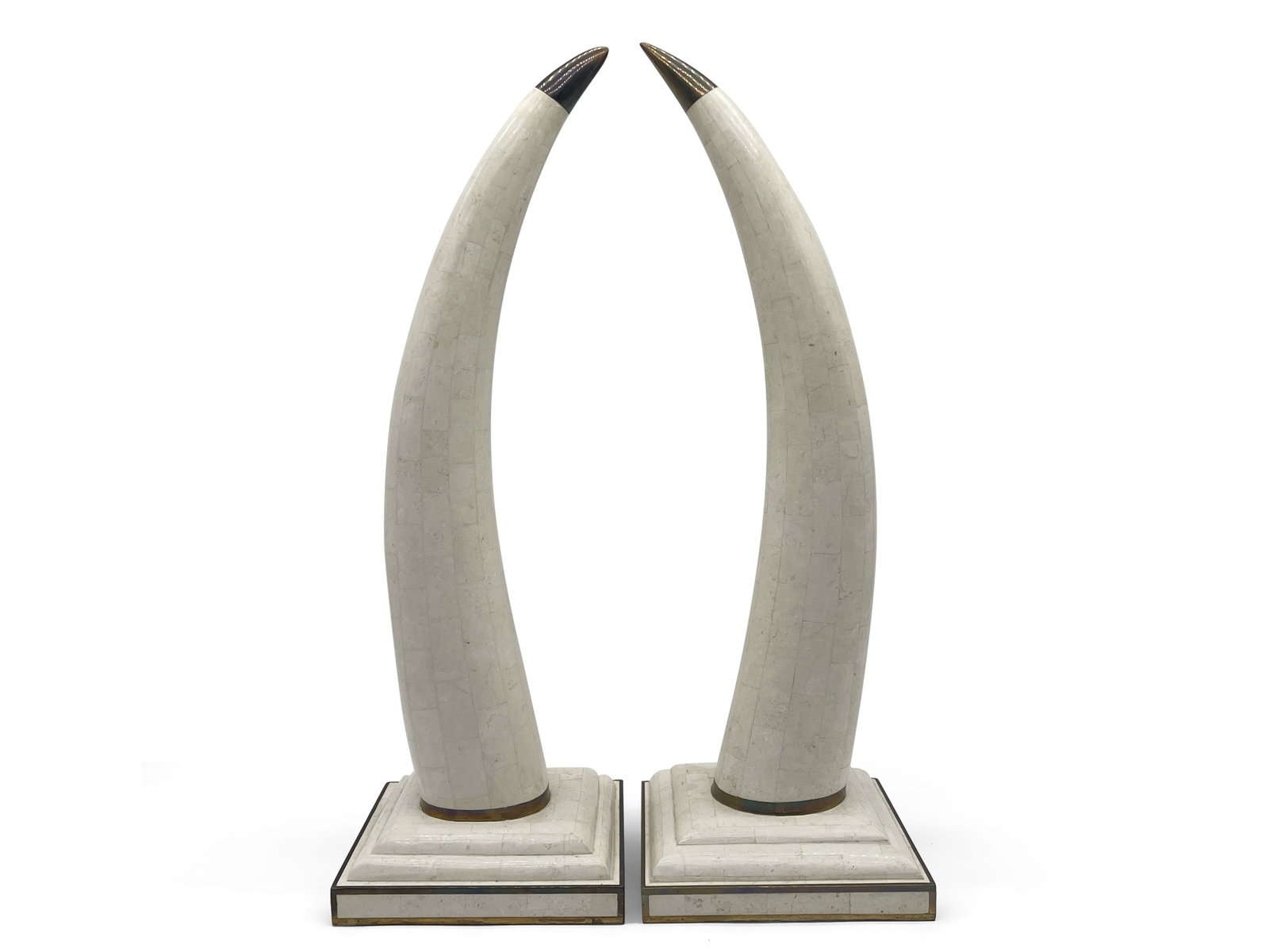 Maitland Smith Tessellated Stone Tusks: A pair of Maitland Smith tessellated stone elephant tusk sculptures with brass accents. Marked on bottom. 24in tall x 8in wide. | Philadelphia Metro area delivery, NYC curbside delivery, and internati