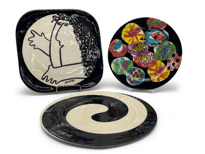 Three Postmodern Studio Pottery and Glass Plates: Three postmodern studio pottery plates to include a signed "Bures" square figural plate, an op art black and white studio glass plate, and a Lorna Jackson Currie abstract plate. Largest: 11-1/2in tall