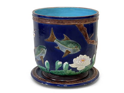 Large Joseph Holdcroft Majolica Jardiniere: A large English majolica jardiniere with under tray, circa late 19th C. by Joseph Holdcroft, in the aesthetic taste with branches, waterlilies, and fish. Stamped on underside of jardiniere. 17in tall