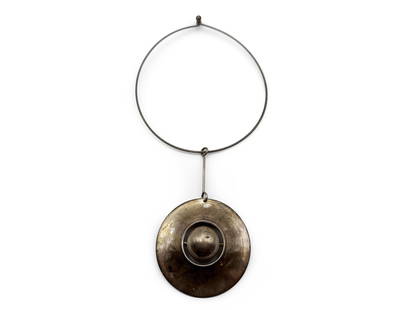 Owe Johannson Modernist Sterling Necklace: A midcentury modern sterling silver choker necklace designed by Finnish artist Owe Johannson, featuring a saucer-form pendant with rotating circular center. Signed. Approx. 16in diameter. 32.9 dwt. |