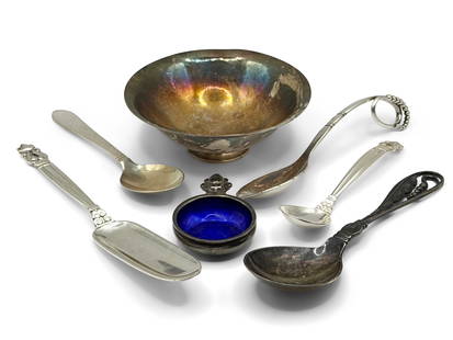 Seven Pieces of Georg Jensen Silver: A grouping of seven pieces of George Jensen sterling silver to include a footed bowl (575B), a salt cellar (62), and various serving articles. All are marked. Bowl: 1-1/2in tall x 4-1/4in wide. 8.5 oz