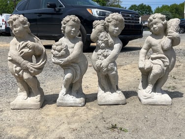 Group of Four Cast Stone Garden Putti