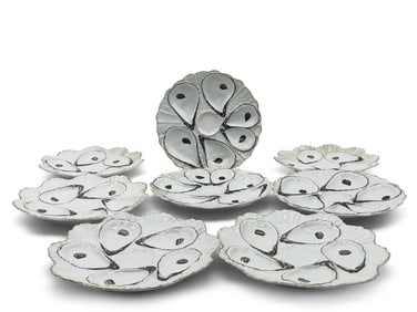 Eight Continental Porcelain Oyster Plates