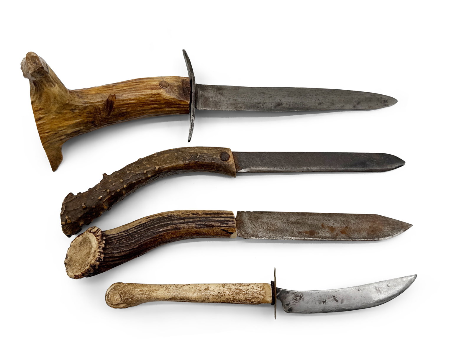 Four Primitive Antler- and Bone-Handled Knives: Four primitive knives with antler and bone handles. Largest: 12in long. | You have additional shipping options! Philadelphia Metro area delivery, NYC curbside delivery, and other third-party shipper d