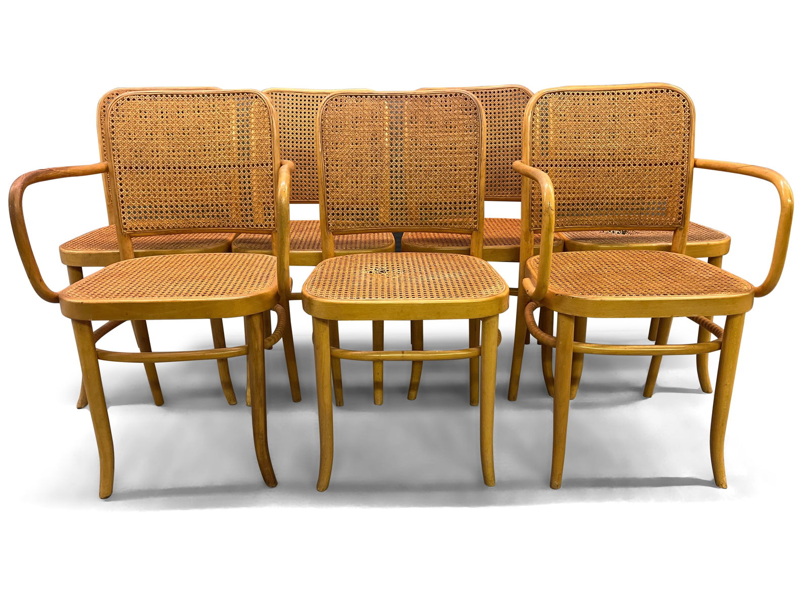 Seven Bentwood and Cane Dining Chairs: A set of seven Josef Hoffman-style bentwood dining chairs with caned seats. Side chairs; 33in tall x 17-1/2in wide x 16in deep. Seat height; 18in. | You have additional shipping options! Philadelphia