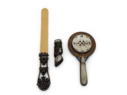 Page Turner, Jade Hand Mirror, and Hoof Vesta: An eclectic grouping to include a floral-decorated bronze and bone page turner, a monogrammed hoof-form vesta, and a Japanese cloisonné and jade hand mirror. Page turner: 10in long. | You have additi