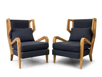 Pair of Contemporary Modern Lounge Chairs: A pair of contemporary modern high-back lounge chairs in the manner of Gio Ponti, with sculpted teak wood frames. 40-1/2in tall x 29-1/2in wide x 36-1/2in deep. | You have additional shipping options!