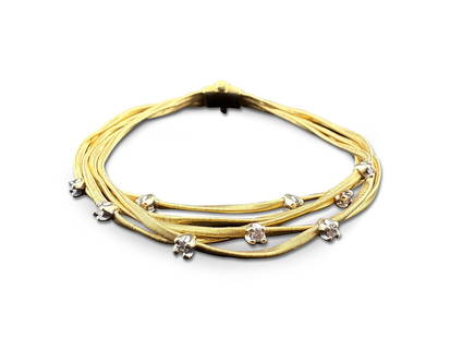 Marco Bicego Marrakech 18K Bracelet with Diamonds: A Marco Bicego Marrakech hand-twisted 18K yellow gold multi-stand bracelet with nine prong set diamonds. Marked. Approx. 7-1/4in long. 11.96 dwt. | You have additional shipping options! Philadelphia M