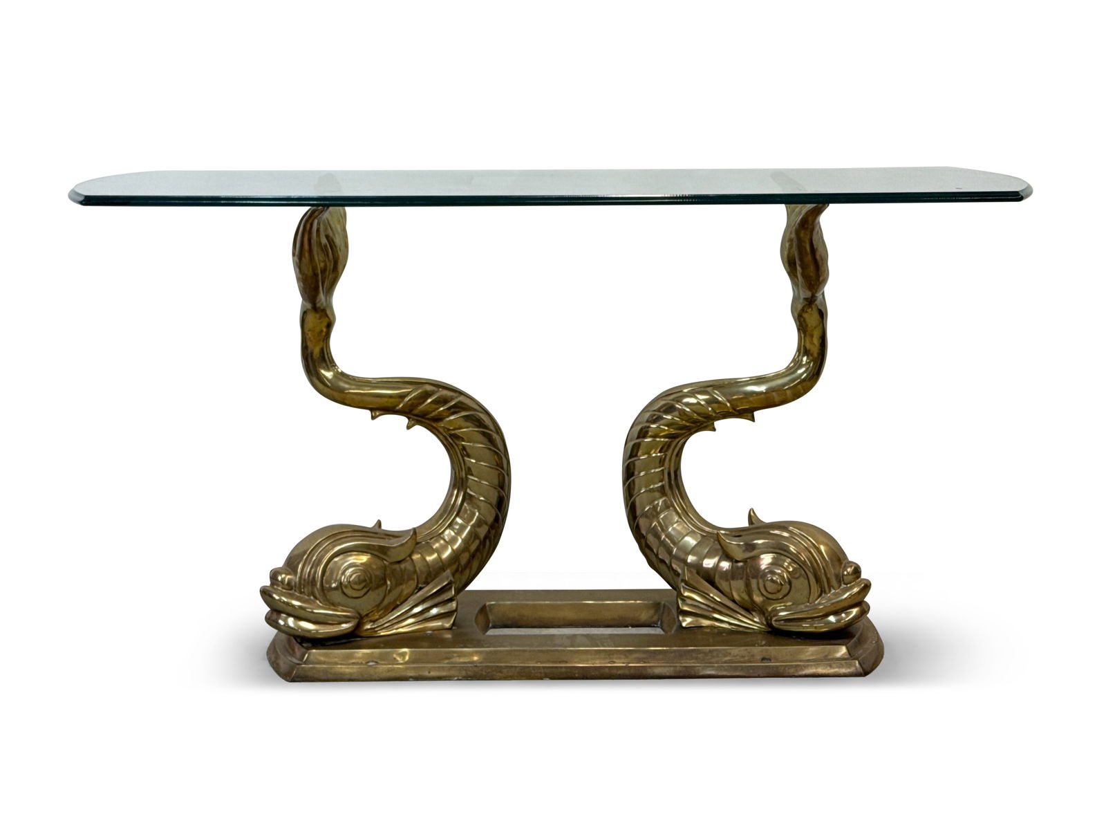 Sculptural Brass Mythical Dolphin Console Table: A Hollywood Regency -style sculptural brass console or sofa table with double mythical dolphin/fish base and glass top. 21in tall x 59-1/2in wide x 20in deep. | You have additional shipping options! P