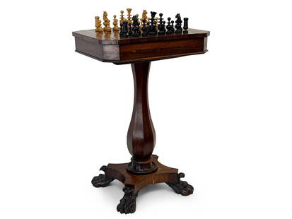 English Regency Rosewood Games Table: An English Regency rosewood games table of pedestal form with a reversible checkerboard top and backgammon insert. Complete with associated pieces. 29-1/2in tall x 20in wide x 16in deep. | You have ad