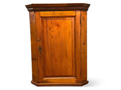 Pine Hanging Corner Cupboard: A hanging pine corner cabinet with a dental-molded top over a single paneled door and shelved interior. 34in tall x 26-1/2in wide x 16in deep. | You have additional shipping options! Philadelphia Metr