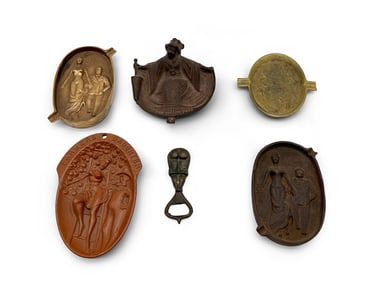 Five Cast Metal Naughty Trays and Bottle Opener