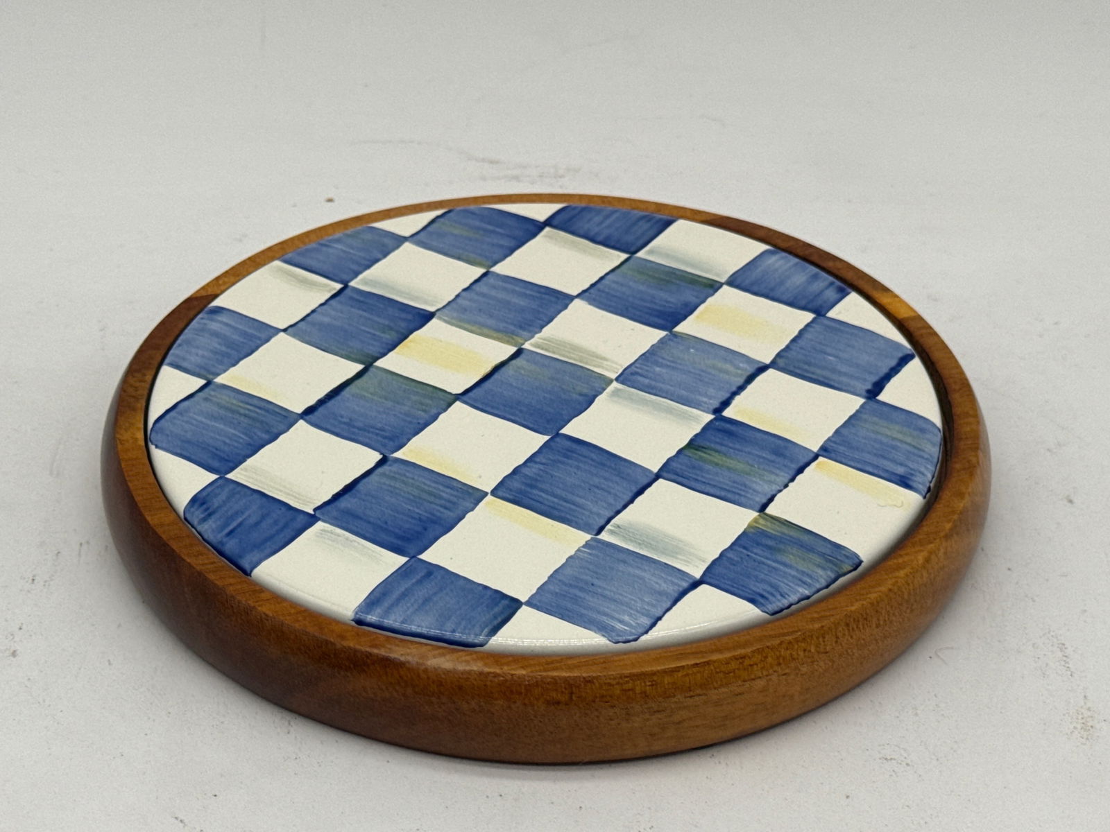 MacKenzie-Childs Royal Check Trivet: A MacKenzie-Childs Royal Check wooden trivet, marked MacKenzie-Childs. 1in tall x 7in wide. | You have additional shipping options, and are not required to use Live Shipping. Additional third-party sh
