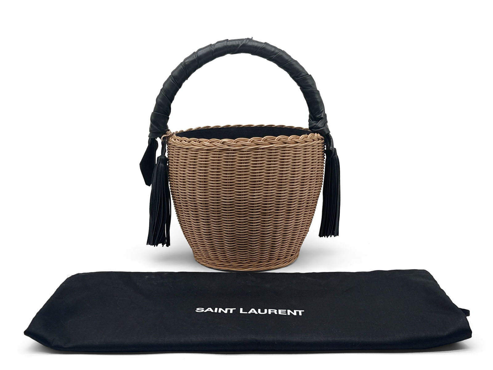 Saint Laurent Panier Wicker Tote: A Saint Laurent Panier wicker tote with leather-wrapped handles and fringe tassels. Marked Saint Laurent. Includes dust cloth bag. 15in tall x 11in wide. | You have additional shipping options, and ar