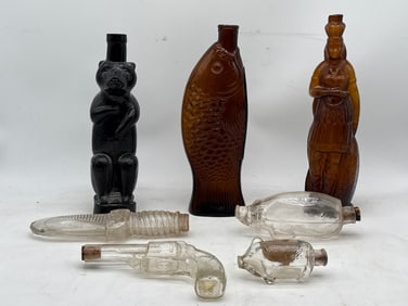 Seven Figural Glass Flasks or Bottles